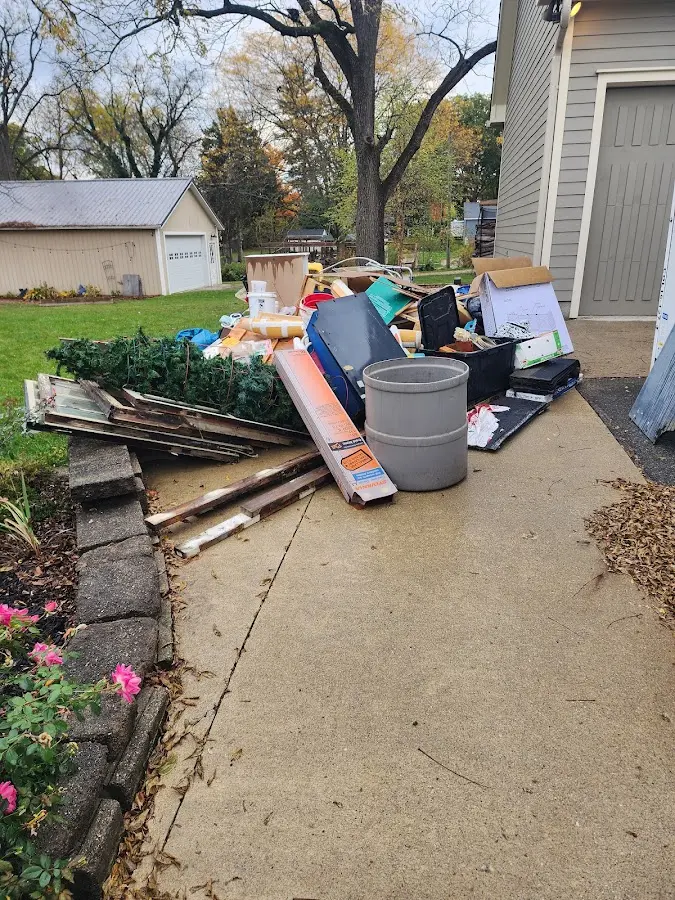 Dumpster being loaded with debris for 10 Yard Dumpster Rental in Endicott